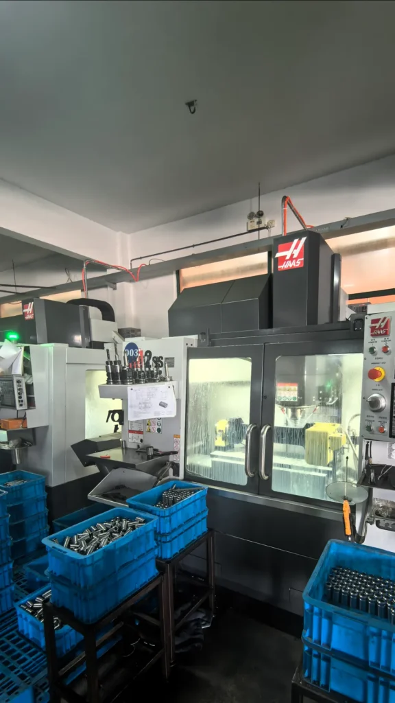 Genuine USA Haas CNC machining centers manufacturing precision core components for heavy-duty hydraulic airless paint sprayers.