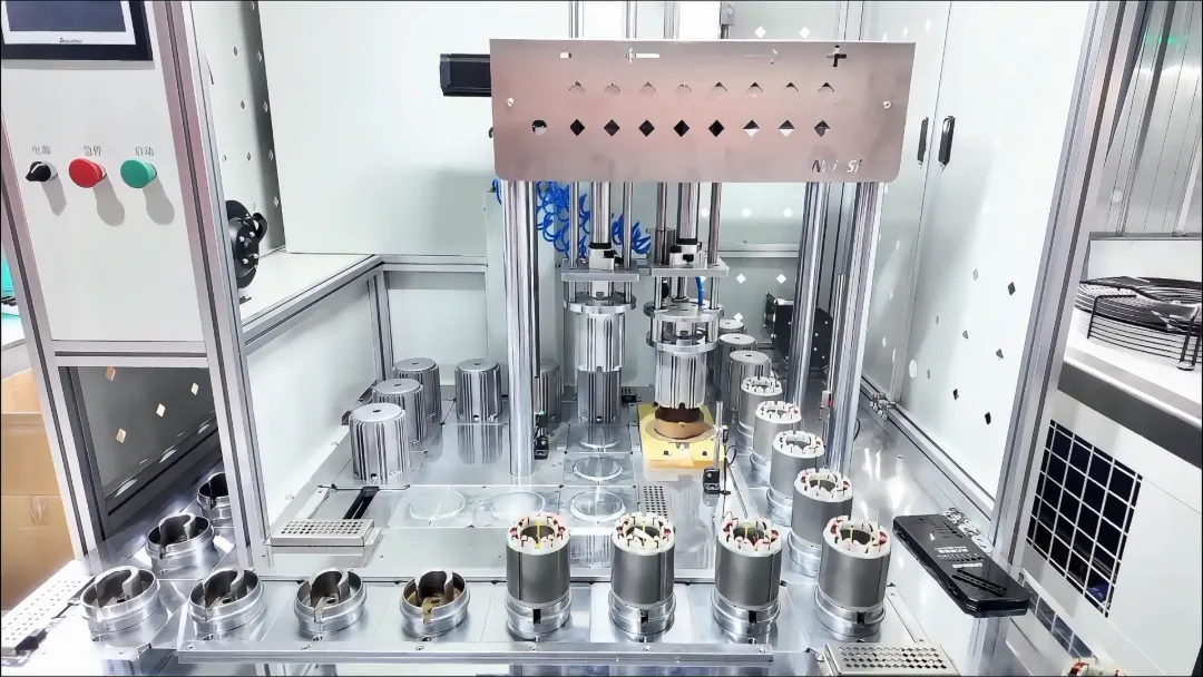 Automated precision assembly machine processing brushless sprayer pump motor stators in a high-capacity OEM factory.